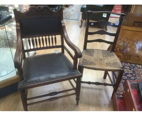 Rush seated ladder back chair and Edwardian leather seated arm chair in the Georgian style.&nbsp;