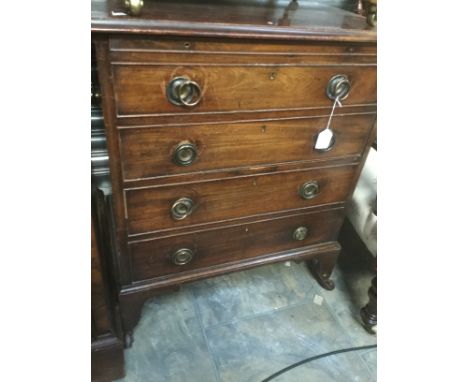 A George III mahogany commode, in the form of a chest of drawers