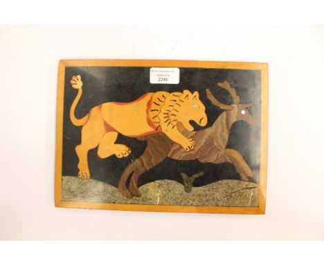 A rectangular slate plaque showing Lion hunting Deer.