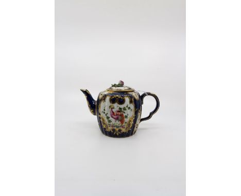 A Worcester blue lobed barrel shaped teapot and cover. Decorated with fan shaped reserves, with exotic birds within a gilt ca