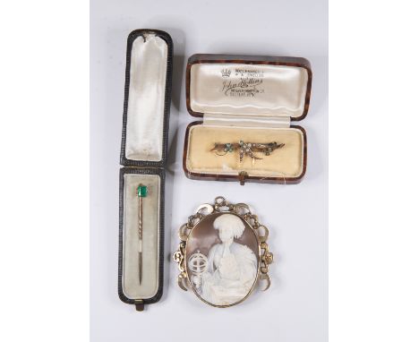 An Edwardian&nbsp; 9ct gold swallow brooch set with seed pearls and turquoise, and an emerald set stick pin set with an emera