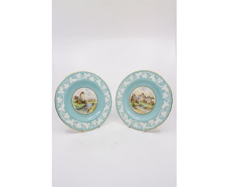 A pair of Royal Crown Derby cabinet plates painted by W.E.J.Dean,one of Haddon Hall the other Ilam Rock,Dovedale on a turquoi