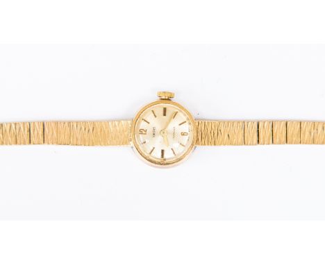 A Smiths 9ct gold ladies watch, textured strap, dial diameter approx 14mm,  length of strap 19cm, total gross weight approx 2