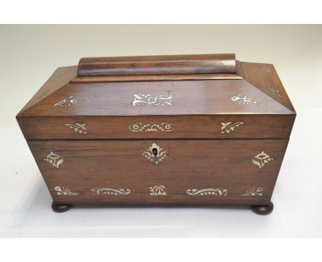 A Regency rosewood tea caddy, of sarcophagus form, mother of pearl inlaid, triple division interior, side handles, bun feet&n
