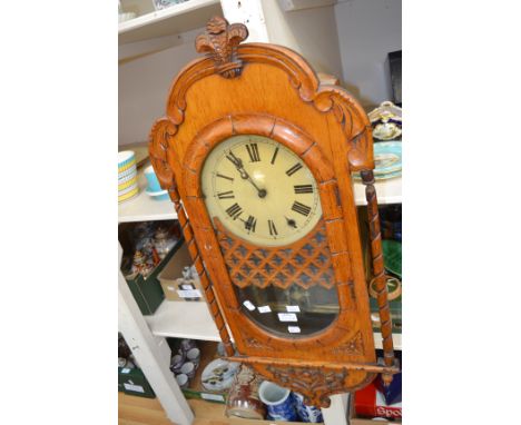 A late Victorian light oak 8 day wall clock, with Prince of Wales frieze