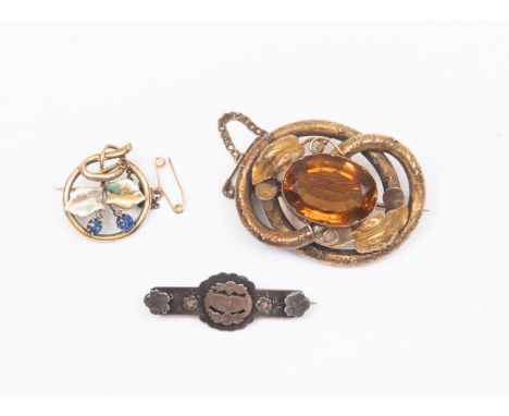 Three brooches including a unmarked yellow metal version, tests as 14ct gold, with sapphire, seed pearl and enamel, circular 