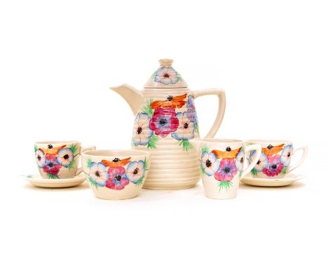 Clarice Cliff tea service. 6 cups, 6 saucers, tea pot, sugar bowl and milk jug. Clarice Cliff markings to base.