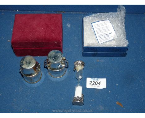 A boxed silver plate on pewter egg timer and boxed silver plate cruet set.