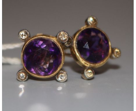 A pair of 9ct gold, amethyst and diamond ear clips.