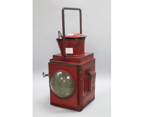 A red British rail lamp