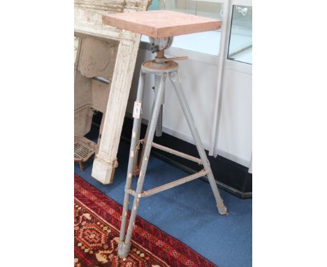 Two iron tripod based sculpture's turntables H.107cm