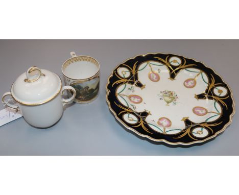 A Chelsea-Derby portrait medallion plate, gold anchor mark, a Derby chocolate cup and cover and a Derby named view coffee can