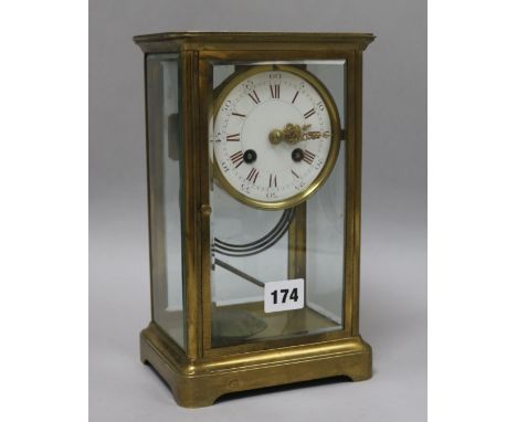 A late 19th century French brass four glass mantel clock