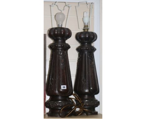 A pair of carved oak table lamp bases