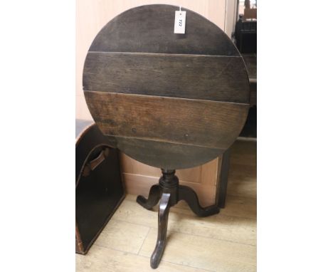 A Georgian oak tilt-top tripod table, W.67cm
