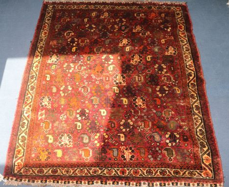 An Iranian red ground carpet with pears, 145 x 117cm