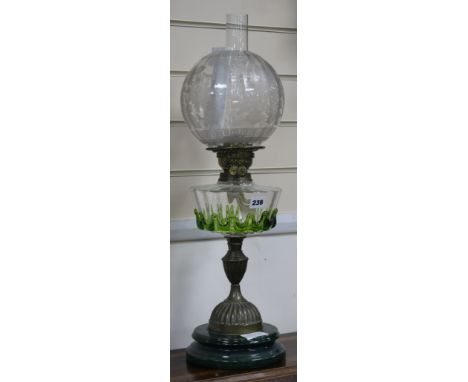 A Victorian glass and brass oil lamp