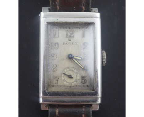 A gentleman's 1930's stainless steel Rolex manual wind wrist watch, with rectangular Arabic dial and subsidiary seconds, the 
