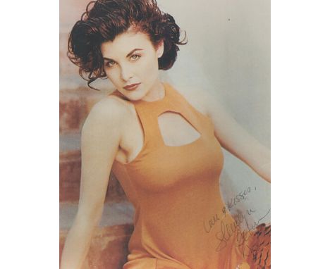 Actress Sherilyn Fenn signed sexy orange 10 x 8 colour portrait photo. Good condition. All autographs come with a Certificate