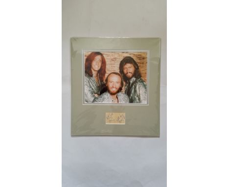 POP MUSIC, The Bee Gees, signed small luggage label by Rob Gill, Barry &amp; Maurice (first names only), overmounted beneath 