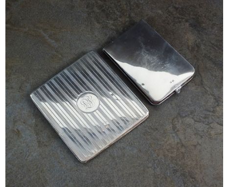 A silver mounted reversible note wallet, Cohen & Charles, Chester 1917, with engine turned decoration and engraved initials, 