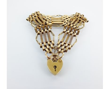 A 9ct gold five bar gate link bracelet, with padlock clasp and attached safety chain, hallmarked London 1970, weight 13.6gms
