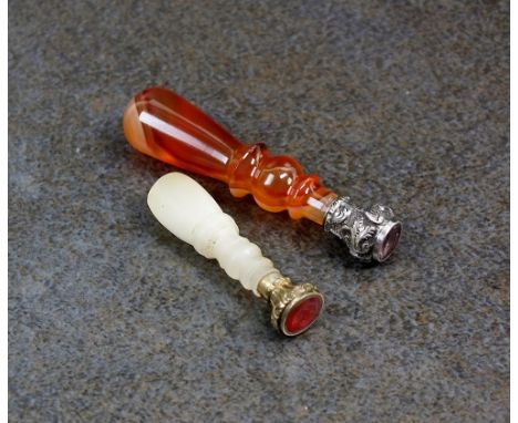 An amethyst set seal, engraved with a dove holding an olive branch, with banded agate and white metal mount, 52mm long, toget