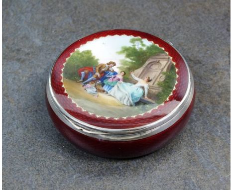 A continental silver and enamel box, import marks for Stockwell & Co, London 1926, the red guilloche enamel circular box with