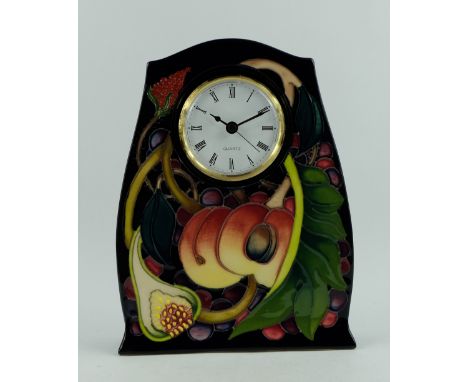 Moorcroft mantle clock decorated in the Queens Choice design dated 2000, height 21cm  (red dot seconds mark)
