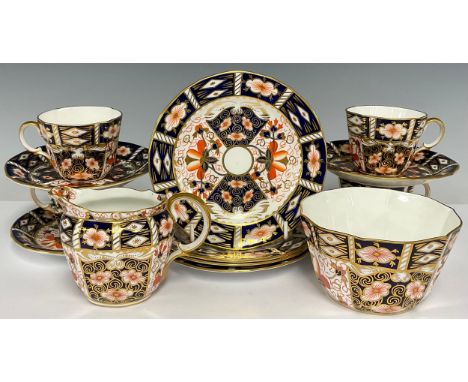 A Royal Crown Derby 2451 Imari pattern tea service for four, comprising sugar basin, cream jug, side plates, cups and saucers