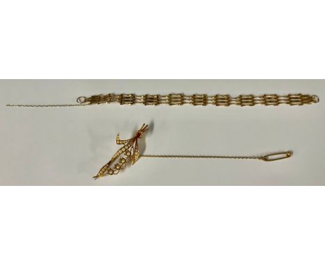 A 15ct gold and seed pearl floral brooch, as Lily of the Valley, marked 15ct, 4.6g gross; a 9ct gold gate link bracelet, lack