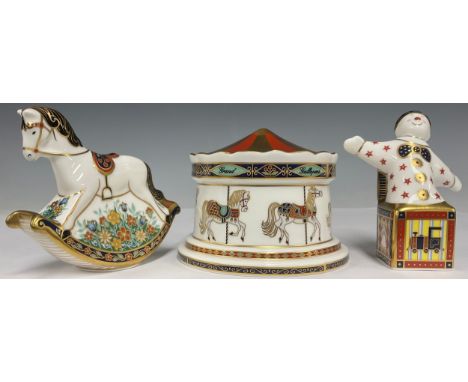 A Royal Crown Derby model, Treasures of Childhood, Carousel Money Box, first quality; others, Jack in the Box, second quality