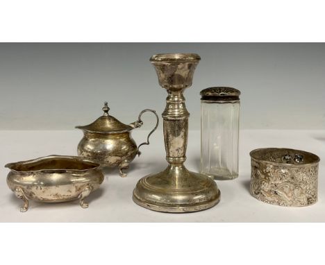 A silver candlestick, 11cm high, Birmingham 1973; a late Victorian silver mustard, Birmingham 1900; a silver salt; etc