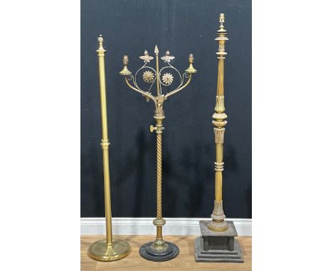 An Arts &amp; Crafts style brass floor lamp, 130.5cm high; another, Neoclassical; another (3)