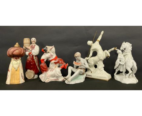 A Herend porcelain model, of a Cossack with rearing horse, in white, 25cm high,a/f; a Zsolnay model, of a boy with melon, pai