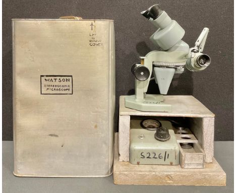 A Watson Barnet stereo microscope, x 10, x 5, x 1.25, serial number 142980, with power pack and stand