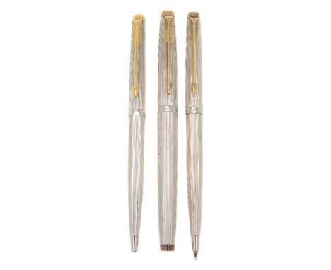 Parker, 75, a white metal fountain pen, ballpoint pen and propelling pencil, with striated decoration and gilt arrow clips, t