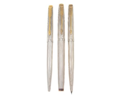 Parker, 75, a white metal fountain pen, ballpoint pen and propelling pencil, with striated decoration and gilt arrow clips, t