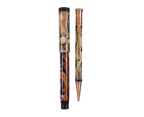 Parker, Duofold Lucky Curve, a green and brown marbled fountain pen and a green marbled propelling pencil, the fountain pen c