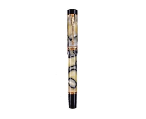 Parker, Norman Rockwell, a limited edition marbled fountain pen, no. 2899/3500, the cap with gilt clip and triple cap band, t