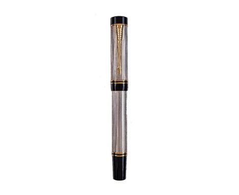 Parker, Duofold Centennial, a silvered fountain pen, the cap with gilt arrow clip and double cap band, the medium nib stamped