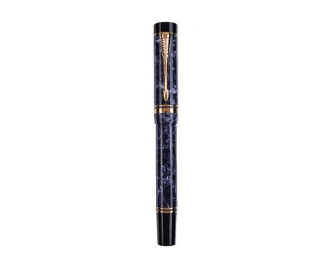 Parker, Duofold, a blue marbled fountain pen, the cap with gilt arrow clip and double cap band, the medium nib stamped 18K 75