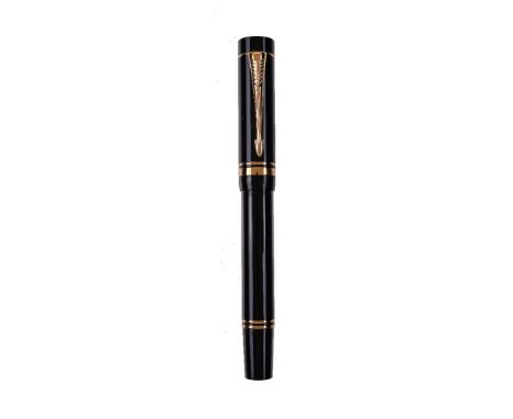 Parker, Duofold, a black fountain pen, the cap with gilt arrow clip and double cap band, the medium nib stamped 18K 750, cart