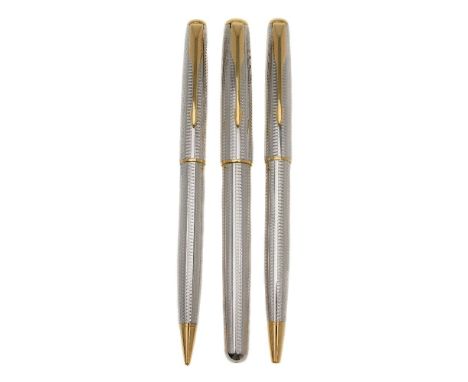 Parker, Sonnet Cascade, a white metal ballpoint pen, rollerball pen and propelling pencil, with engine turned decoration and 