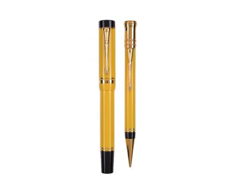 Parker, Duofold, a yellow fountain pen and propelling pencil, the fountain pen cap with gilt arrow clip and double cap band, 