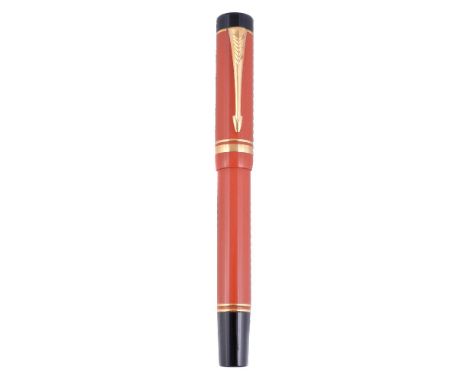Parker, Duofold Centennial, an orange fountain pen, the cap with gilt arrow clip and double cap band, the medium nib stamped 
