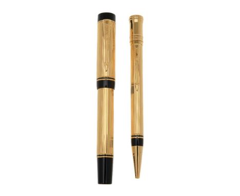 Parker, Duofold Centennial, a gold plated fountain pen and propelling pencil, the fountain pen cap with gilt arrow clip, the 