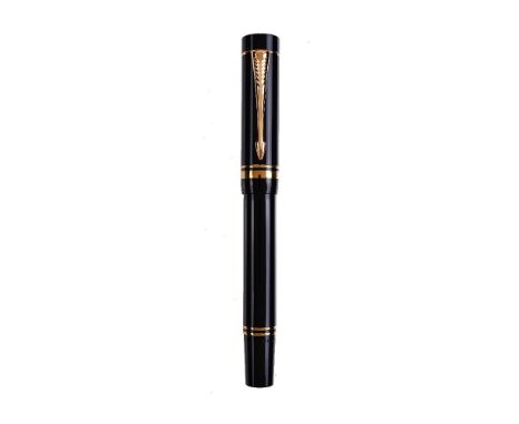 Parker, Duofold, a black fountain pen, the cap with gilt arrow clip and double cap band, the medium nib stamped 18K 750, cart