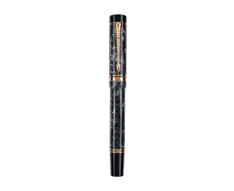 Parker, Duofold, a green marbled fountain pen, the cap with gilt arrow clip and double cap band, the medium nib stamped 18K 7