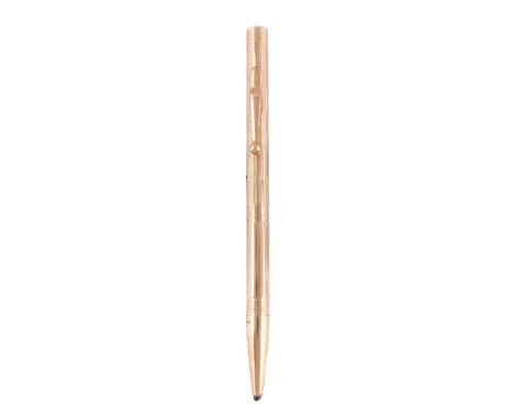 Tiffany &amp; Co., a gold coloured propelling pencil, with striated decoration, a clip, engraved R. C., stamped 14K